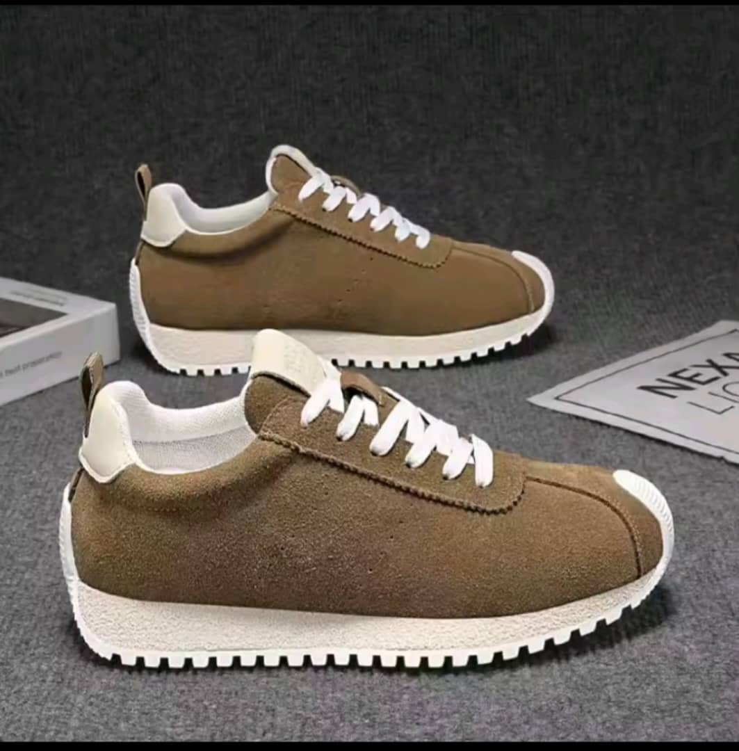 Men's brown faux-suede retro runner sneaker featuring a white heel tab, white laces, center toe seam, and a white ridged rubber sole.
