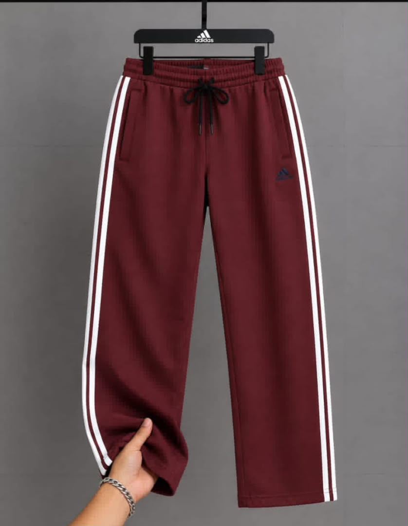 Maroon Adidas athletic track pants with white 3-stripes and drawstring waist.