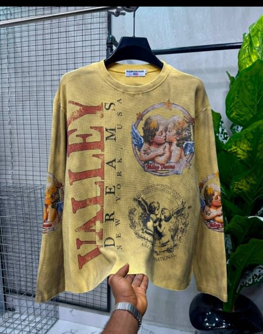 Dark Brown Valley Dreams Thermal Top Mustard yellow graphic long-sleeve thermal top with vintage cherub artwork and text.